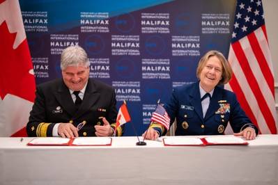 Mario Pelletier, Commissioner of the Canadian Coast Guard and Admiral Linda Fagan, Commandant, United States Coast Guard signing the renewed Canada-United States Joint Marine Pollution Contingency Plan. (Photo: U.S. Coast Guard)