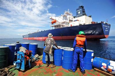 A crew member prepares to board a tanker that was hijacked by pirates in Benin on July 24, 2011. Photo: IRIN/Daniel Hayduk
