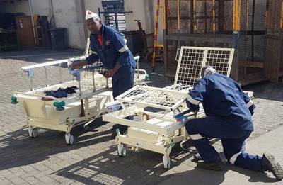 Members of Namdock’s technical and fabrication teams working to refurbish hospital beds for Walvis Bay’s state hospital (Photo: Namdock)