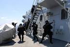 Members of the Brunei Special Forces rush towards the pilot house of the Arleigh Burke-class guided-missile destroyer USS Howard (DDG 83) during a visit, board, search and seizure exercise. Howard, along with the Brunei Air Force and Royal Brunei Navy, are participating in South East Asia Cooperation Against Terrorism exercises off the coast of Brunei. Howard and the Ronald Reagan Carrier Strike Group are on a scheduled deployment in the U.S. 7th Fleet area of responsibility operating in the wes