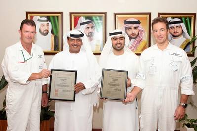 (l-r) Mark Morris, Director - Global HSEQ; Khamis Juma Buamim, Chairman; Mohammad  Alawadhi, Global Quality Manager; Dr. Markus Voege VP Operations & Production DDW