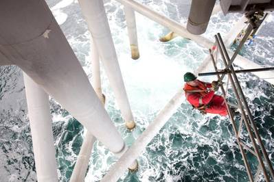 A multi-disciplined Stork operative erecting underdeck scaffolding.