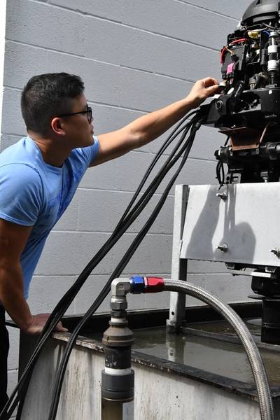 Nhan Bui, a statistician with the High Power Microwave (HPM) Weapon Systems Division at Naval Surface Warfare Center Dahlgren Division, works on an HPM system. HPM is designed to be a safer alternative to other vessel stopping mitigations, using nonlethal methods.  Phouto courtesy Naval Surface Warfare Center Dahlgren Division