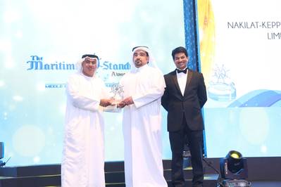 N-KOM Shipyard Director Mr Jassim Al-Shirawi (center) receiving the award from ADNATCO-NGSCO’s CEO Dr. Ali Al Yabhouni (left) at the TMS Awards ceremony held in Dubai.  (Photo credit: The Maritime Standard)