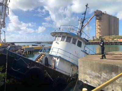 Coast Guard pollution response personnel from Resident Inspection Office St Croix assess the pollution threat from the partially sunken tugboat Cape Lookout Nov. 13, 2020, which partially sank at the St. Croix Renaissance Group facility within Krause Lagoon in St. Croix, U.S. Virgin Islands. (U.S. Coast Guard photos)