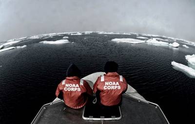 NOAA officers aboard one of the smaller survey vessels contemplate the vastness of the Chukchi Sea during the NOAA Ship Fairweather's reconnaissance survey in 2013. (Credit: NOAA)