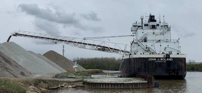 ohn J Boland discharging cargo from its port side using its self-unloading boom in Lorain, Ohio, after the grounding. (Source: NTSB)