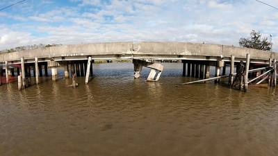 On December 23, 2021, at approximately 3:26 a.m., a towing vessel pushing six barges was traveling southeast along the Avoca Island Cutoff waterway when one of the lead barges in the tow struck the Bayou Ramos Bridge. (Photo: U.S. Coast Guard District 8, Courtesy of Cajun Drone Photography, Jim Pierce JR FAA 107 Certified Pilot)
