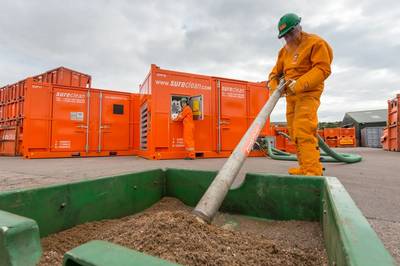 Sureclean operatives demonstrating vacuum transfer technology