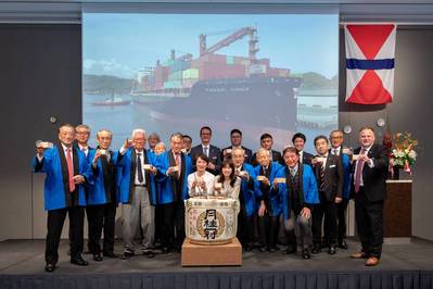 Participating in the traditional Kagami-biraki ceremony, Jeremy Sutton, CEO, Swire Shipping (center, in blue tie); Chris Robertson, Country Manager – Japan, Swire Shipping (rightmost); share a toast together with former Swire employees (blue traditional Happi coats) and the current Japan team. Image courtesy Swire Shipping