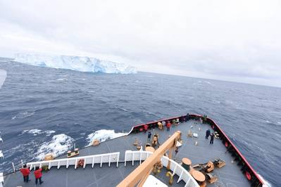 Passengers and the crew of CGC Polar Star gather to observe their first encounter with ice during Operation Deep Freeze 2016 in the Southern Ocean Jan. 3, 2016. (U.S. Coast Guard photo by Grant DeVuyst)