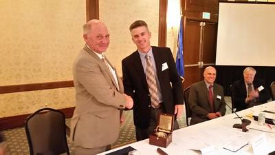 Immediate Past-President Paul Hankins congratulates new ASA President Todd Schauer (Photo: ASA)