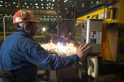 Paul Bosarge, a burner specialist workleaderman at Ingalls Shipbuilding, initiates a cut of steel on the National Security Cutter Kimball (WMSL 756) using the Avenger 3 Plasma cutter (Photo by Andrew Young/HII)