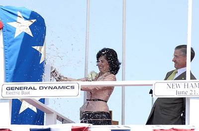 PCU New Hampshire (SSN 778) sponsor Cheryl McGuinness and General Dynamics Electric Boat President John P. Casey formally christen the fifth Virginia class submarine Saturday, June 21, 2008 at General Dynamics Electric Boat shipyard in Groton, Conn. McGuinness, a resident of Portsmouth, H.H., lost her husband, Tom, on September, 11, 2001, in the World Trade Center attacks. He was a co-pilot on American Airlines Flight 11. U.S. Navy photo by John Narewski