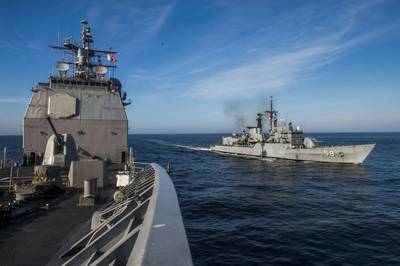 The Peruvian frigate BAP Quiñones (FM 58) is underway alongside the Ticonderoga-class guided-missile cruiser USS Lake Champlain (CG 57) during a leapfrog exercise. Lake Champlain is participating in Silent Forces Exercise 2018 with the Peruvian and Colombian navies. (U.S. Navy photo by Mass Communication Specialist 1st Class Nathan Carpenter/)