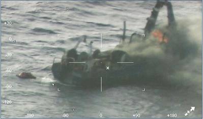 ​(Photo taken from the U.S. Coast Guard HC-144 aircraft showing the bow of the Nobska on fire before the rescue. Source: U.S. Coast Guard)