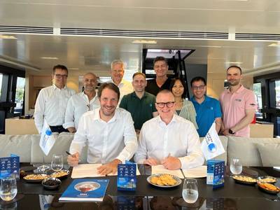 Pictured at the MOU signing (front, left to right) Cyril Ducau, Chief Executive Officer, EPS and Bjarne Foldager, Country Manager, Denmark, MAN Energy Solutions (Photo: MAN)