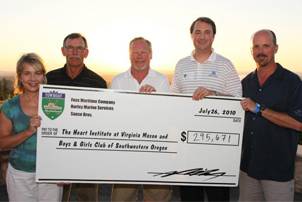 Pictured from left to right: Denise Gould of Boys & Girls Club, Dick Lauer from Sause Bros., Keith Barnes from Harley Marine Services, Michael VanDerhoef from Virginia Mason Foundation and Dave Hill from Foss Maritime presenting the donation check from the day’s events. Photo courtesy Harley Marine Services