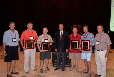 Pictured Left to Right: Mike Lapeyrouse (AEU), Otto Candies, Jr. (Candies Shipbuilding), Perry Triche (US United Bulk Terminals), Coach Gene Stallings, Bill Hardy (Beacon Maritime), John Bullock (Willis of AL representing Signal International), Jimmy Burgin (AEU)