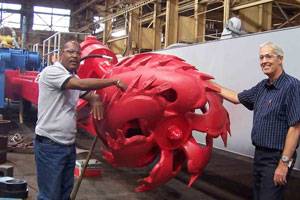 Pictured (right to left) Ellicott's Director of Manufacturing Robert Thomas with Plant Manager Alexander Green in front of 670 dredge currently under manufacture. (Photo courtesy Ellicott Dredges)