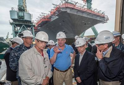 Pictured with U.S. Sens. Tim Kaine and Jack Reed  in front of USS Abraham Lincoln are (left to right) Capt. Karl Thomas, the ship’s commanding officer; Todd West, director, Newport News’ RCOH program; and Chris Miner, Newport News’ vice president of in-service aircraft carrier programs. Photo by Chris Oxley, Huntington Ingalls Industries