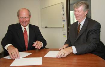 On left, President William B. Eisenhardt of Cal Maritime with Billy Owen, Clear Port Vice President.