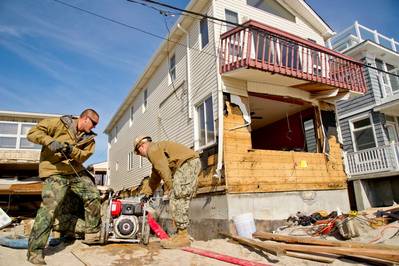 Pumping Out Residential Premises: Photo credit USN