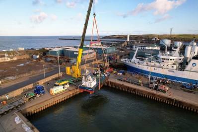 Réalt na Farraige, built by Dales Marine Services, as it was lowered into Aberdeen harbor. Photo courtesy Dales Marine