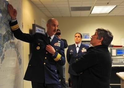 Rear Adm. Thomas Ostebo, commander District 17, explains Coast Guard operations in the Arctic and the distances covered by Coast Guard assets throughout Alaska to Secretary of Homeland Security Janet Napolitano, Monday, Aug. 5, 2012, during a tour of Base Kodiak, Alaska. Napolitano toured Base Kodiak and addressed assembled Coast Guardsmen at Air Station Kodiak while on a visit to several Coast Guard units across the state. U.S. Coast Guard photo by Petty Officer 3rd Class Jonathan Klingenberg. 