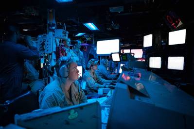 RED SEA (Oct. 19, 2023) Sailors aboard the Arleigh Burke-class guided-missile destroyer USS Carney (DDG 64) stand watch in the ship's combat information center during an operation to defeat a combination of Houthi missiles and unmanned aerial vehicles in the Red Sea, Oct. 19, 2023. (Source: US Navy)