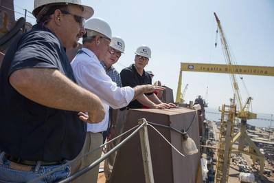 Rep. Bradley Byrne (second from left) toured Ingalls Shipbuilding and the amphibious transport dock John P. Murtha (LPD 26). Pictured with Byrne are (left to right) LPD 26 Ship Construction Manager Hank Corcoran, LPD Program Director Mike Duthu and Ingalls Shipbuilding President Brian Cuccias. Rep. Steven Palazzo also participated in the tour but is not pictured. Photo by Andrew Young/HII
