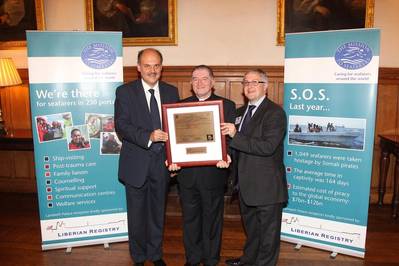 Revd Canon Ken Peters receiving his honorary masters licence from Michalis Pantazopoulos (left) and Jonathan Spremulli, general manager of LISCR’s London office (right)