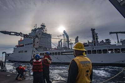 Sailors aboard the Arleigh Burke-class guided-missile destroyer USS Lenah Sutcliffe Higbee (DDG 123) conduct a replenishment-at-sea with the fleet replenishment oiler USNS John Lewis (T-AO 205) in the South China Sea, May 29, 2025. Higbee, assigned to the Nimitz Carrier Strike Group, is underway in the U.S. 7th Fleet area of operations on a scheduled deployment, demonstrating the U.S. Navy’s unwavering commitment to a free and open Indo-Pacific. (U.S. Navy photo by Mass Communication Specialist 
