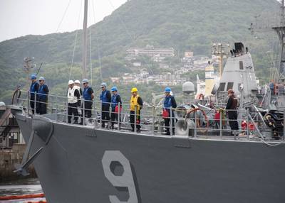 Sailors man the rails of Avenger-class mine countermeasures ship USS Pioneer (MCM 9) as the ship leaves a Commander, U.S. Fleet Activities Sasebo pier. Avenger-class ships are designed as mine sweepers/hunter-killers capable of finding, classifying and destroying moored and bottom mines. (U.S. Navy Photo by Kristopher S. Haley)