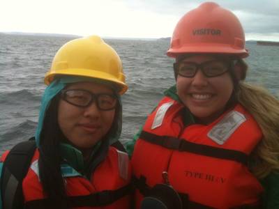 Scholarship winners Ariel Zhou (left) and Caiti Campbell (right) aboard Crolwey's tug, Guardsman