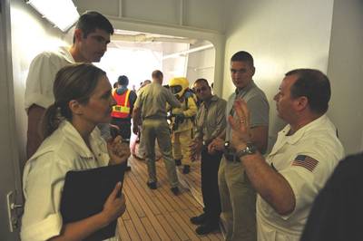 Scott Elphison, senior marine inspector for the Coast Guard Cruise Ship National Center of Expertise, addresses students and fellow instructors in a cruise ship inspection on Oct. 31, 2009. The lesson was part of an Advanced Foreign Passenger Vessel Examination course.