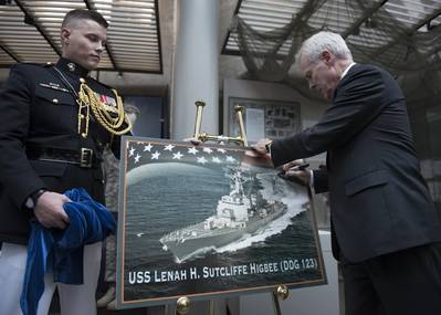 Secretary of the Navy Ray Mabus signs a graphic representation of the future guided-missile destroyer USS Lenah H. Sutcliffe Higbee (DDG 123) at the Women in Military Service for America Memorial. (U.S. Navy photo by Armando Gonzales)