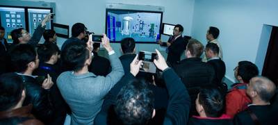 Seen here is WinGD training manager Tyson Liang Qin presenting the W-FMS virtual reality engine room to a delegation of ship owners. (Photo: WInGD)