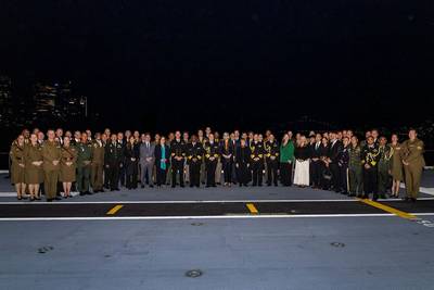 Senior government and military officials from 19 participating nations stand together as part of the Exercise Talisman Sabre 25 Opening Ceremony event onboard HMAS Adelaide, Sydney, New South Wales.