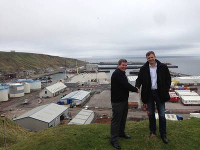 Shaking hands on a trailblazing agreement – Hugh Simpson, left, and Knut Magne Johannessen at Scrabster Harbour