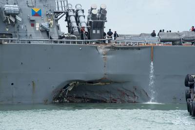 Significant visible damage to the hull of Guided-missile destroyer USS John S. McCain (DDG 56) following a collision with the tanker Alnic MC while in the Straits of Malacca and Singapore on August 21, 2017. (Photo: Joshua Fulton / U.S. Navy)
