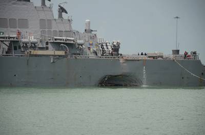 Significant visible damage to USS John S. McCain (DDG 56) following a collision with the merchant vessel Alnic MC while underway east of the Straits of Malacca and Singapore on Aug. 21. (U.S. Navy photo by Madailein Abbott)