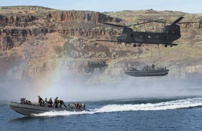 Special Warfare Combatant-craft Crewmen conduct a Maritime External Air Transportation System training evolution in Moses Lake, Wash. (U.S. Army photo by Christopher Prows)