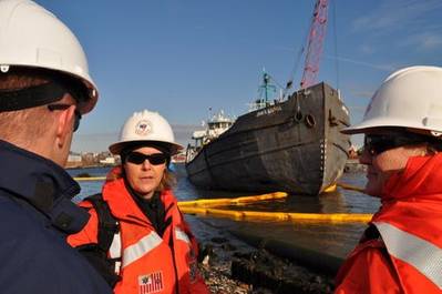 Stranded Tankship & Salvors: Photo credit USCG