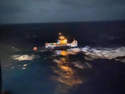 The 62-foot tugboat, Gulf Man, and a barge afloat approximately six miles northeast of Andros Island, Bahamas, January 9, 2020. A Coast Guard helicopter crew hoisted all three crewmembers and transported them to Nassau, Bahamas. (Photo: U.S. Coast Guard) 