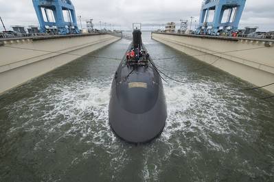The 7,800-ton Virginia-class submarine John Warner was moved with the help of three tugboats to Newport News Shipbuilding’s submarine pier, where final outfitting, testing and crew certification will take place over the next six months. SSN 785 is the first Virginia-class submarine to be named for a person. Photo by Ricky Thompson/HII