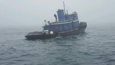 The 80-foot tugboat Capt Mackintire in tow on Wednesday, February 21. The tugboat later sank about three miles south of Kennebunk, Maine. (U.S. Coast Guard photo)