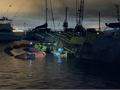 The Coast Guard and partner agencies are responding to a 120-foot dredge barge Capt Leo II that capsized in the Charleston Harbor Resort and Marina, Charleston, South Carolina, August 4, 2021. (Photo: U.S. Coast Guard)