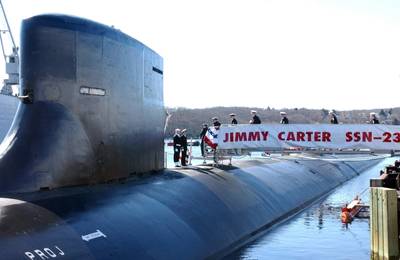 The crew assigned to the Jimmy Carter (SSN-23) bring her to life as they board the newly commissioned Seawolf-class nuclear-powered attack submarine at Naval Submarine Base Groton, Conn., February 19, 2005. (U.S. Navy photo: Roadell Hickman)