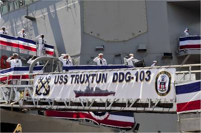 The crew of the guided-missile destroyer USS Truxtun (DDG 103) mans the rails after bringing the ship to life at the ship's commissioning ceremony. (U.S. Navy photo by Rebekah Blowers)